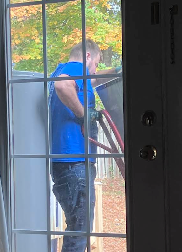 Brothers Air HVAC tech installing AC unit